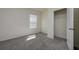 Bedroom featuring plush carpeting, a closet, and natural light from a window at 5764 Hollingworth Trl, Wesley Chapel, FL 33545