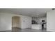 Spacious open-concept kitchen with stainless steel appliances, granite countertops, and ample lighting at 5764 Hollingworth Trl, Wesley Chapel, FL 33545