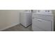 A utility room with a standard-sized washer and dryer at 5764 Hollingworth Trl, Wesley Chapel, FL 33545