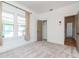 A light, airy bedroom with plush carpet and large windows creates a peaceful and inviting space at 5807 N Miami Pl, Tampa, FL 33604