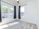 Bright bedroom with large windows, dark curtains, and plush carpeting, creating a cozy and inviting space at 5807 N Miami Pl, Tampa, FL 33604
