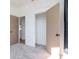 Bright bedroom featuring closet doors, an open doorway, and plush carpeting, creating a cozy and inviting space at 5807 N Miami Pl, Tampa, FL 33604