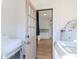 Laundry room showcasing a view to the kitchen and modern appliances at 5807 N Miami Pl, Tampa, FL 33604