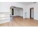 Bright living room featuring hardwood floors, white walls, ceiling fan and built in shelves at 5807 N Miami Pl, Tampa, FL 33604