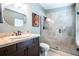 Modern bathroom with a glass-enclosed shower, tile surround, and stylish vanity at 6531 Spring Oak Ct, Tampa, FL 33625