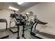 Modern gym featuring treadmills and elliptical machine on a black rubber floor at 6600 Sunset Way # 112, St Pete Beach, FL 33706