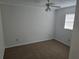 Bedroom features closet, neutral walls, neutral carpeting, and a window at 6704 Hickorywood Ln # 2B, New Port Richey, FL 34653