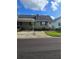 Charming single-story home featuring a quaint covered parking and cozy front yard with mature landscaping at 6704 Hickorywood Ln # 2B, New Port Richey, FL 34653