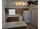 Well-equipped kitchen features bright countertop, white appliances, and ample cabinet space for storage at 6704 Hickorywood Ln # 2B, New Port Richey, FL 34653