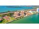 Gorgeous aerial view of a beachfront community with condos, townhomes, tennis, and boat docks at 7432 Sunshine Skyway S Ln # 602, St Petersburg, FL 33711