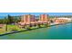 Aerial view of condos with waterfront access, landscaping, and convenient parking at 7432 Sunshine Skyway S Ln # 602, St Petersburg, FL 33711
