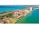 Beautiful aerial view of waterfront condos featuring a tennis court and stunning bay views at 7432 Sunshine Skyway S Ln # 602, St Petersburg, FL 33711