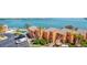 Aerial view of condos with a community pool, landscaped grounds, and waterfront views at 7432 Sunshine Skyway S Ln # 602, St Petersburg, FL 33711