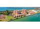 Stunning aerial view of beachfront condo community with pool, tennis courts, and private docks at 7432 Sunshine Skyway S Ln # 602, St Petersburg, FL 33711