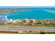 Breathtaking aerial view of bayside community near highway and tennis courts with sparkling bay waters at 7432 Sunshine Skyway S Ln # 602, St Petersburg, FL 33711