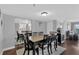 Elegant dining area features a dining set, a mirrored wall, and a view into the living area at 7432 Sunshine Skyway S Ln # 602, St Petersburg, FL 33711