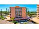 Multi-story condo building featuring private balconies, well-maintained landscaping and convenient parking at 7432 Sunshine Skyway S Ln # 602, St Petersburg, FL 33711