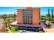 Multi-story condo building featuring private balconies, well-maintained landscaping and convenient parking at 7432 Sunshine Skyway S Ln # 602, St Petersburg, FL 33711