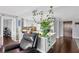 Open-concept living area with a comfortable chair, showcasing modern white countertops and a view of the kitchen at 7432 Sunshine Skyway S Ln # 602, St Petersburg, FL 33711