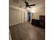 Bright bedroom with wood floors, double closets, and neutral color palette at 7530 Roy Ct, New Port Richey, FL 34654