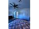 Cozy bedroom featuring wood floors, double closet, and neutral color scheme at 7530 Roy Ct, New Port Richey, FL 34654