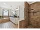 Primary bathroom featuring double vanity, shower, and soaking tub at 8307 Bluevine Sky Dr, Land O Lakes, FL 34637