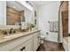 Bathroom featuring double sinks, granite countertops, and tiled shower/bath combination at 8307 Bluevine Sky Dr, Land O Lakes, FL 34637