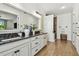Spacious bathroom with double sink vanity, granite countertop, and separate walk-in shower at 8307 Bluevine Sky Dr, Land O Lakes, FL 34637