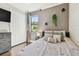 Bedroom featuring soft color palette, wood floors, and natural light at 8307 Bluevine Sky Dr, Land O Lakes, FL 34637