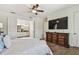 Spacious main bedroom with ensuite bathroom access and a large dresser at 8307 Bluevine Sky Dr, Land O Lakes, FL 34637