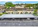 Aerial view of a complex with carport parking, landscaping, and architecture of buildings and surrounding trees at 9209 Seminole Blvd # 145, Seminole, FL 33772