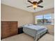 This cozy bedroom features a ceiling fan and a large window letting in natural light at 9209 Seminole Blvd # 145, Seminole, FL 33772