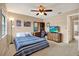 Bedroom features natural lighting, a ceiling fan, and furniture for relaxing and study at 9209 Seminole Blvd # 145, Seminole, FL 33772
