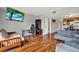 Bright living area featuring a futon, workspace, TV, and dining nook, creating a versatile and inviting space at 9209 Seminole Blvd # 145, Seminole, FL 33772