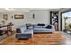Cozy living room featuring stylish furniture, wood floors, and a bright window showcasing modern interior design at 9209 Seminole Blvd # 145, Seminole, FL 33772