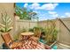 Enclosed patio is nicely decorated with a table, chairs and a variety of plants at 9209 Seminole Blvd # 145, Seminole, FL 33772