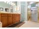 Bathroom featuring a double vanity with a separate glass-enclosed shower and toilet at 9339 Creole Ct, Weeki Wachee, FL 34613