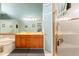 Bathroom with a double sink vanity, soaking tub, and a separate glass-enclosed shower at 9339 Creole Ct, Weeki Wachee, FL 34613