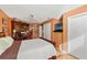 Bedroom with hardwood floors, ceiling fan, and a built-in media center at 9339 Creole Ct, Weeki Wachee, FL 34613