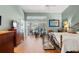 Bright bedroom with hardwood floors and sliding glass doors to the backyard pool at 9339 Creole Ct, Weeki Wachee, FL 34613