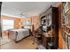 Bedroom with hardwood floors, ceiling fan, and an abundance of natural light at 9339 Creole Ct, Weeki Wachee, FL 34613