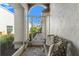 Cozy front porch featuring a decorative iron gate and a comfortable seating area, perfect for relaxation at 9339 Creole Ct, Weeki Wachee, FL 34613