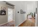 Hallway that provides access to various areas of the home, including a bathroom and a living area, for ease of movement at 9339 Creole Ct, Weeki Wachee, FL 34613