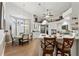 Spacious kitchen with white cabinetry, stainless appliances, and breakfast bar seating at 9339 Creole Ct, Weeki Wachee, FL 34613