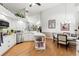 Bright kitchen features white cabinets, center island, and adjacent dining area at 9339 Creole Ct, Weeki Wachee, FL 34613