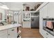 Well-equipped kitchen boasting stainless appliances, white cabinets, and adjacent dining space at 9339 Creole Ct, Weeki Wachee, FL 34613