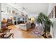 Bright living room features high ceilings, hardwood floors, and comfortable seating at 9339 Creole Ct, Weeki Wachee, FL 34613