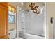 Bathroom features a tiled shower with a clear glass door and decorative lizard at 9466 127Th Ave, Largo, FL 33773