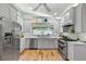Bright kitchen features updated cabinets, countertops, stainless steel appliances, and stylish window treatments at 9466 127Th Ave, Largo, FL 33773