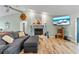 Cozy living room with stone fireplace, flat-screen TV, and comfortable seating at 9466 127Th Ave, Largo, FL 33773